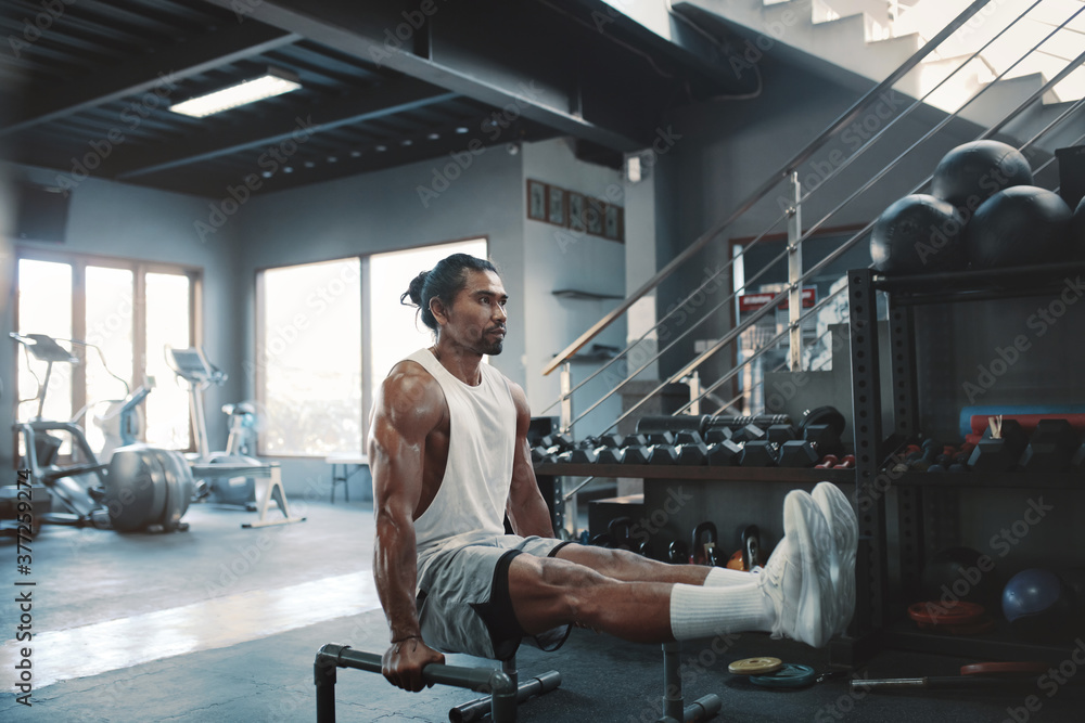 Workout. Man With Parallettes Exercising At Gym. Asian Male Bodybuilder Using Steel Sport Equipment For Push-Ups Training. Sexy Sportsman With Strong, Healthy, Muscular Body. Fitness As Lifestyle. Workout. Man With Parallettes Exercising At Gym. Asian Male Bodybuilder Using Steel Sport Equipment For Push-Ups Training. Sexy Sportsman With Strong, Healthy, Muscular Body. Fitness As Lifestyle.