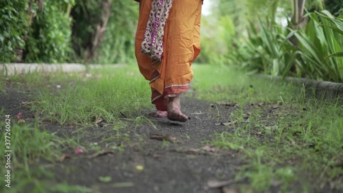 Man Barefoot Walking in Slow Motion| Hindu God Dress  photo