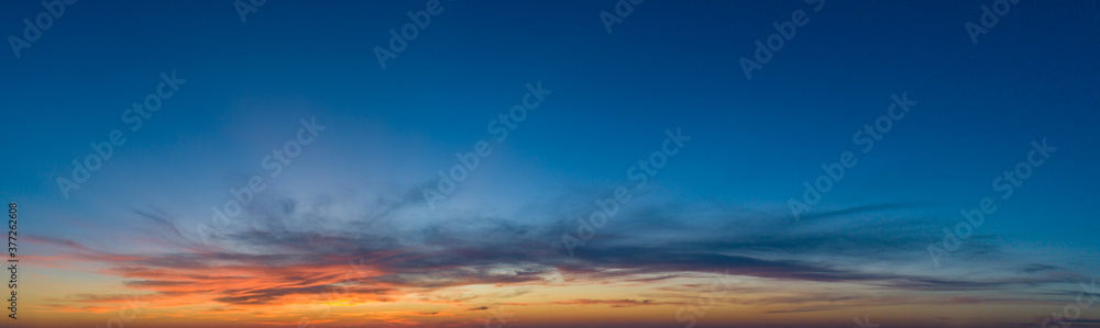 Obraz premium Large panorama with sunset sky with multicolor clouds
