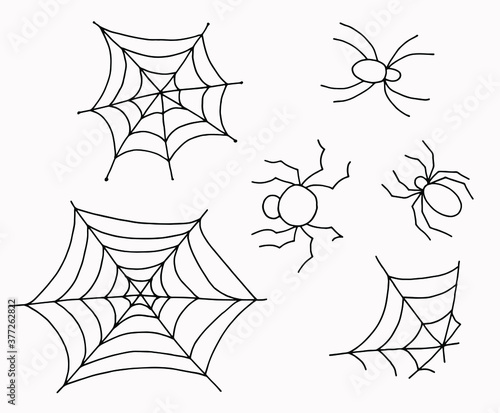 Set of spider webs and spiders in doodle style. Drawings for Halloween. White background, isolator. Stock illustration.