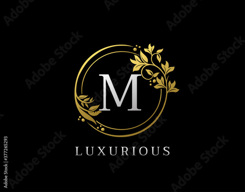 Luxury Circle M Letter Floral Design. Elegant Gold M Royal Logo Icon.