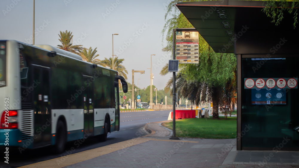Signs and Symboles for social distancing in Abu Dhabi bus station.