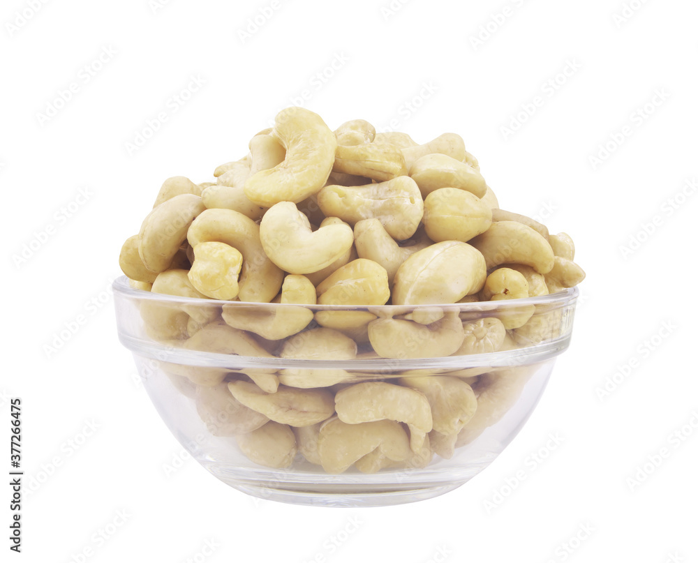Cashew nuts in glass bowl isolated on white Cashew nuts in glass bowl isolated on white