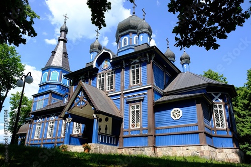 Beautiful historic wooden Orthodox church in the village of Puchly in Podlasie, Poland. This area is called the Land of Open Shutters photo