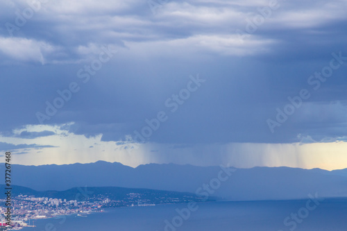 Dramatic storm scenery over the Adriatic Sea, with dark cumulus rain clouds