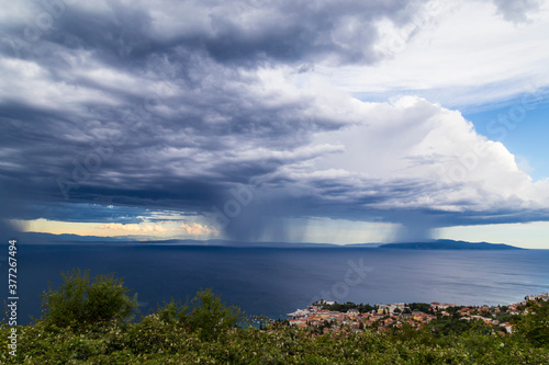 Dramatic storm scenery over the Adriatic Sea  with dark cumulus rain clouds