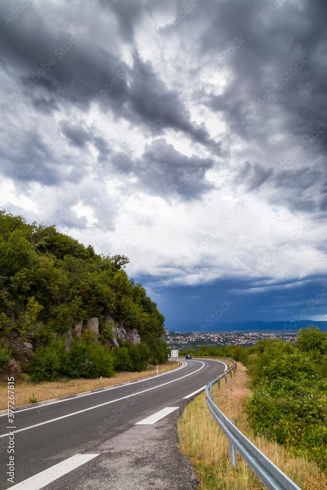 Dramatic storm scenery over the Adriatic Sea, with dark cumulus rain clouds