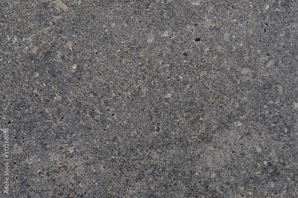 Abstract background of black asphalt with inclusions of pebbles Abstract background of black asphalt with inclusions of pebbles