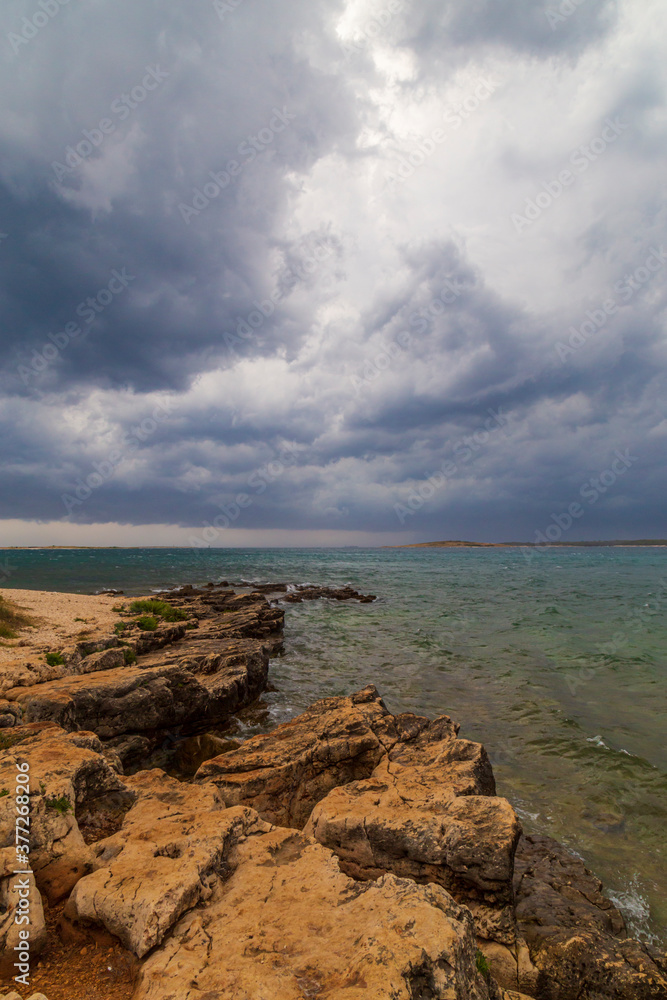 Dramatic storm clouds and rain over the Adriatic Sea in summer Dramatic storm clouds and rain over the Adriatic Sea in summer