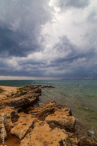 Dramatic storm clouds and rain over the Adriatic Sea in summer