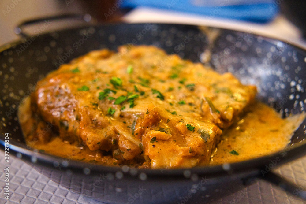 A piece of delicious Italian lasagna in rich fish sauce A piece of delicious Italian lasagna in rich fish sauce