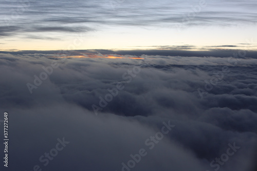 soft and beautiful clouds from above at sunrise, nature at it's best