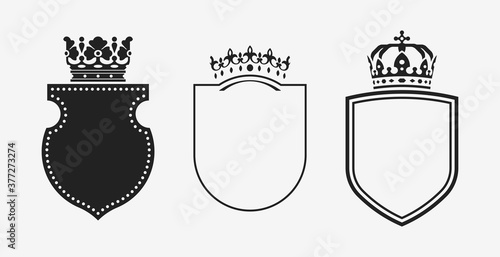 Set of crowns with shields. Black heraldic decoration vector elements.