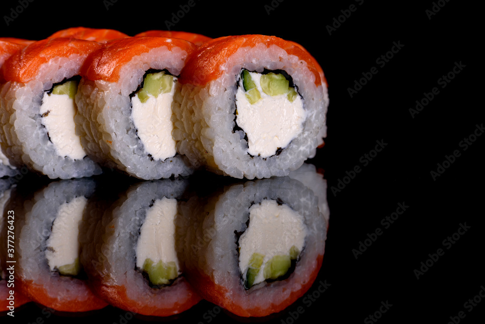 Fresh delicious beautiful sushi rolls on a dark background Fresh delicious beautiful sushi rolls on a dark background