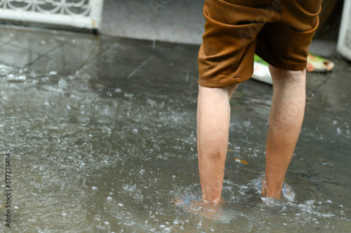 Legs walking through the flood