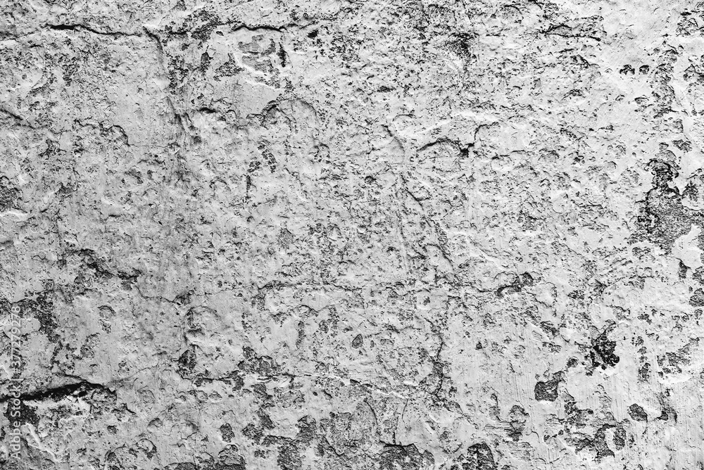 Texture of a concrete wall with cracks and scratches which can be used as a background