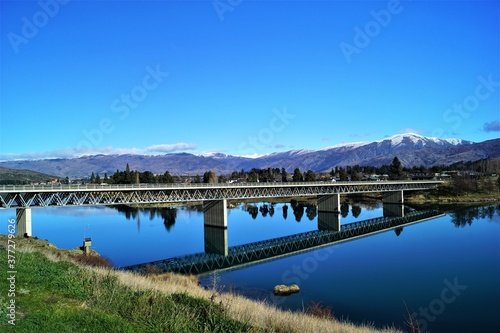 Wallpaper Mural A bridge with blue sky crossing a river on a drive from Queenstown to Christchurch Torontodigital.ca