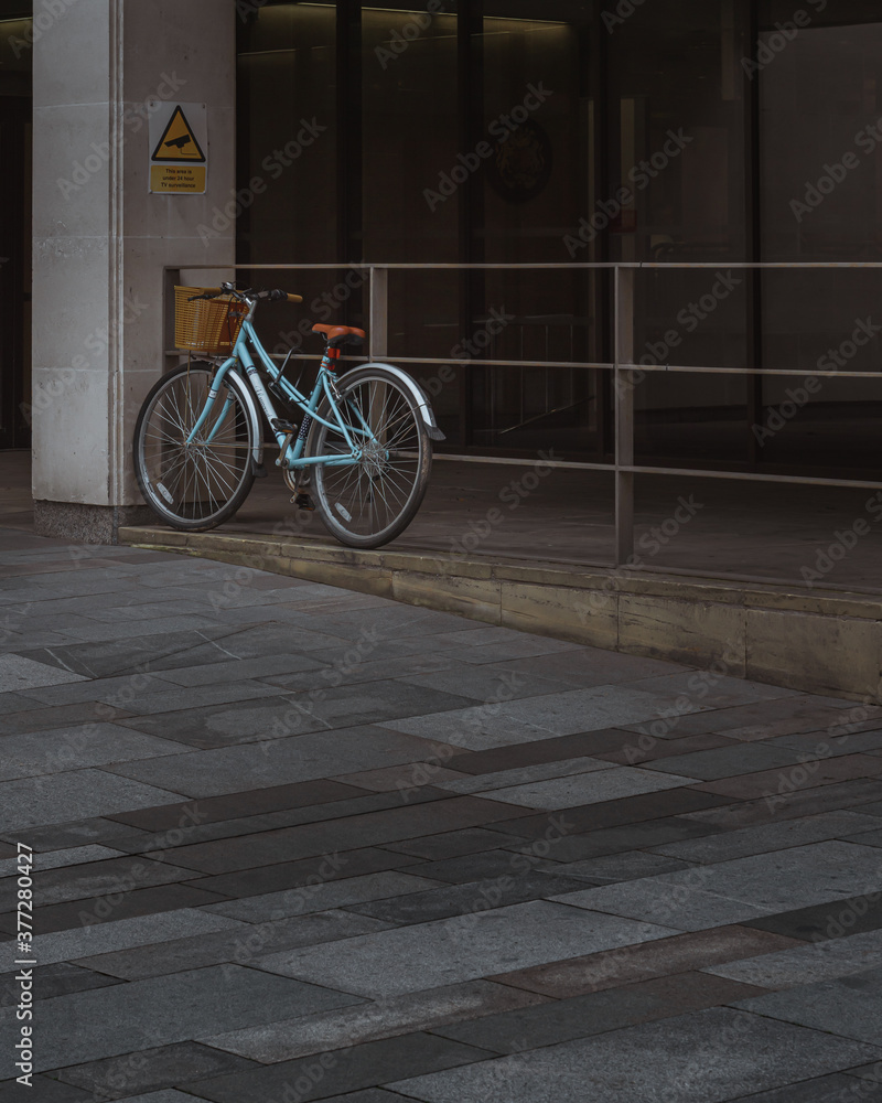 A lone bicycle leans against railings in Manchester City Centre A lone bicycle leans against railings in Manchester City Centre
