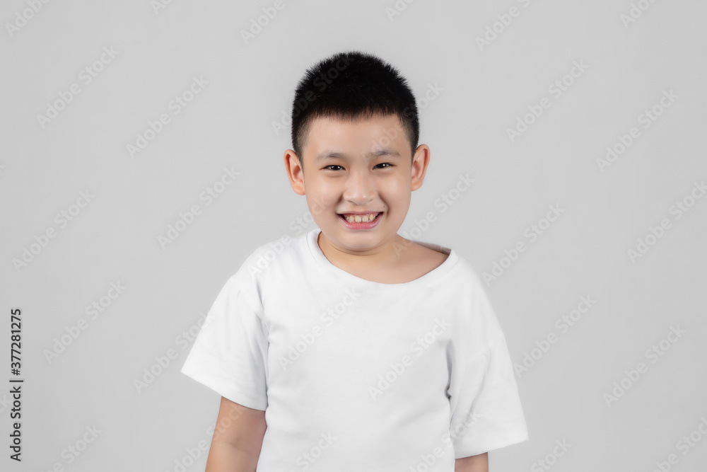 Asian boys studio shot portrait on gray background Asian boys studio shot portrait on gray background