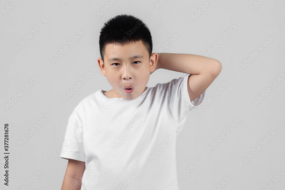 Asian boys studio shot portrait on gray background Asian boys studio shot portrait on gray background