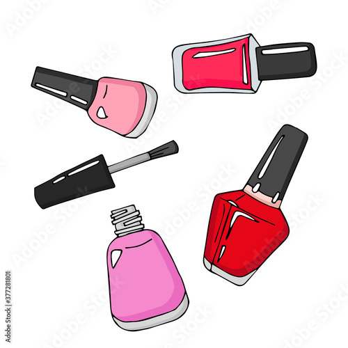 manicure and pedicure varnish bottles. One bottle is open and near the cap with a tassel.