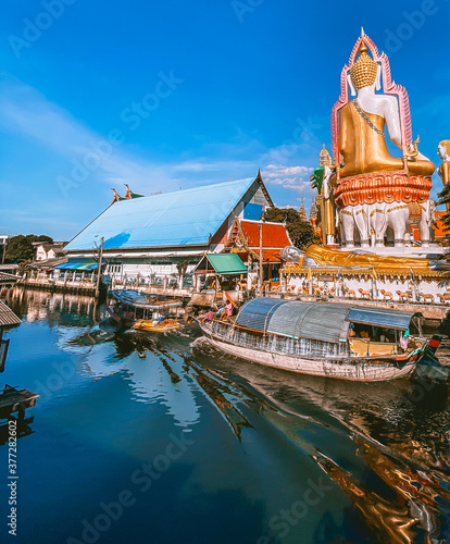 Around the khlong near Wat Paknam Bhasicharoen, a temple, pagoda and Buddha statue in Bangkok Thailand