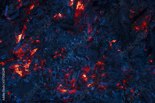 background of red burning coals in the night