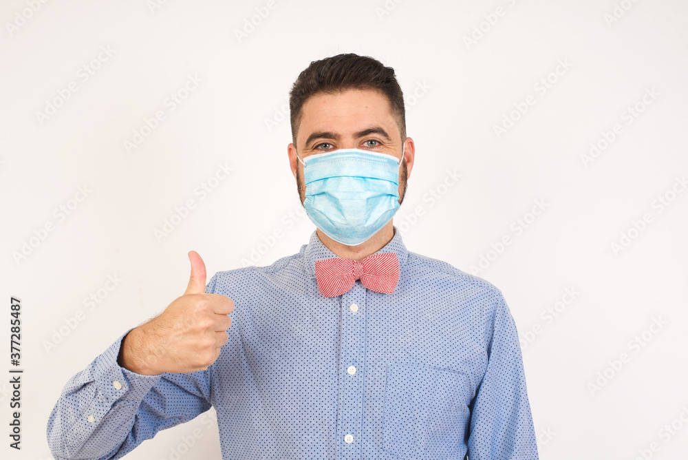Good job! Portrait of a happy smiling blue eyed young successful man giving thumb up gesture standing outdoors. Positive human emotion facial expression body language. Funny girl Good job! Portrait of a happy smiling blue eyed young successful man giving thumb up gesture standing outdoors. Positive human emotion facial expression body language. Funny girl