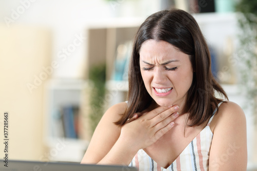 Woman suffering throat ache complaining at home