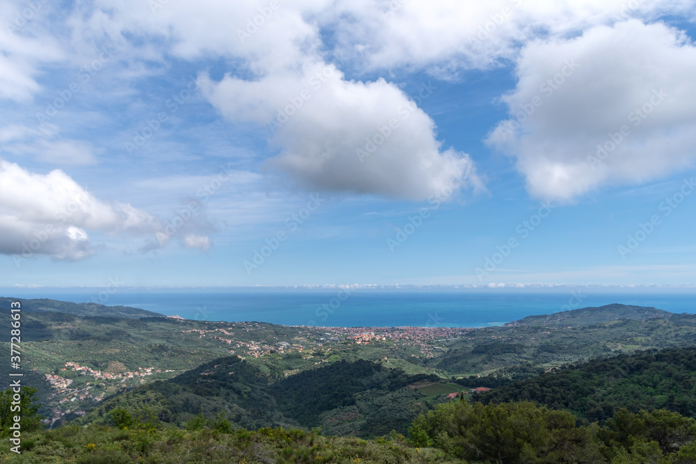 View of the Gulf of Diano Marina protected by mountains covered by Mediterranean vegetation, Province of Imperia, Liguria region, Italy