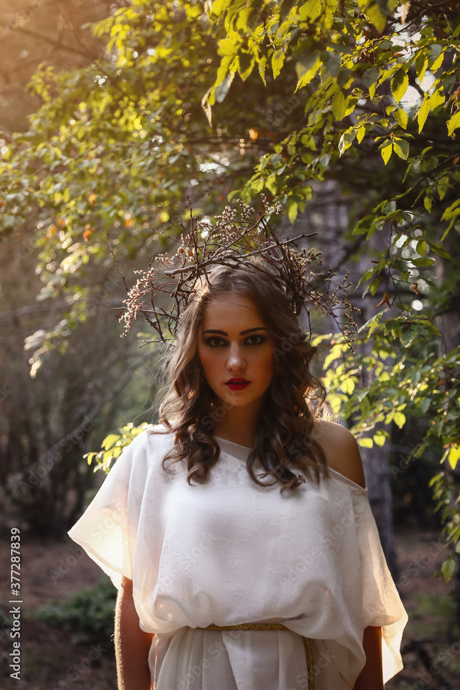 Beautiful mystery gothic woman in long white dress in autumn forest. Beautiful mystery gothic woman in long white dress in autumn forest.