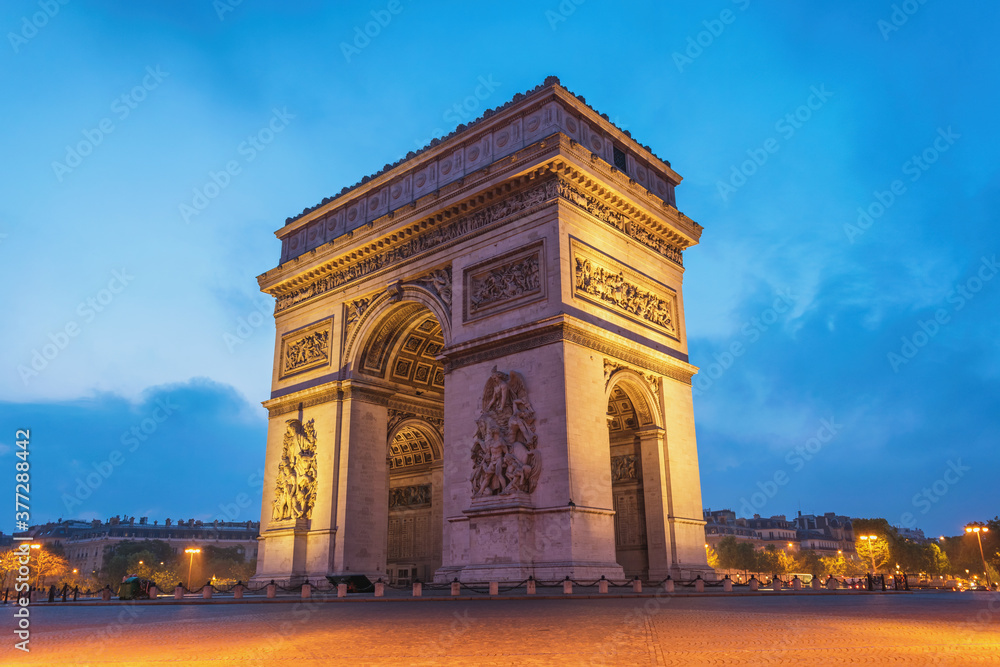 Paris France city skyline night at Arc de Triomphe and Champs Elysees empty nobody