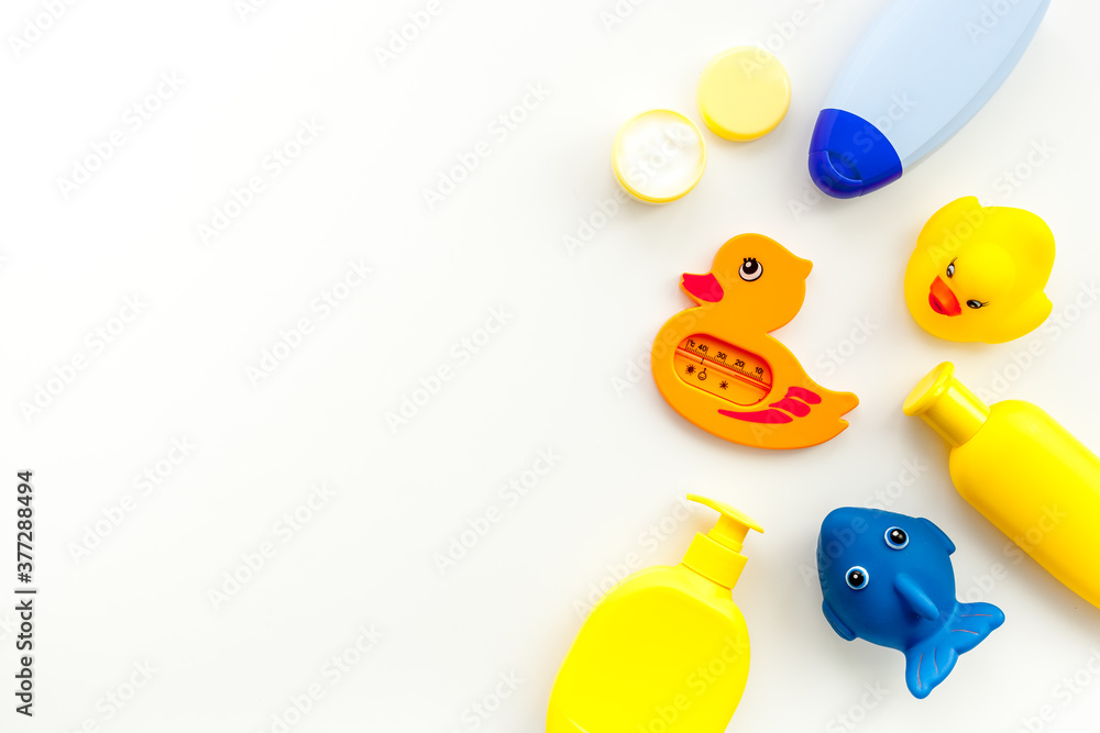 Bath cosmetics and Toy for child. Shampoo, gel, cream, soap and towel. White background top view Bath cosmetics and Toy for child. Shampoo, gel, cream, soap and towel. White background top view