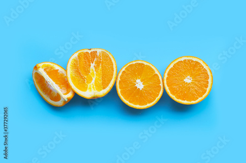 High vitamin C  Juicy and sweet. Fresh orange fruit  on blue background.