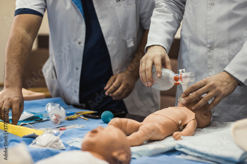 Resuscitation of the newborn. Students practice. Simulation