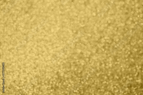 Abstract blur gold glitter sparkle defocused bokeh light background