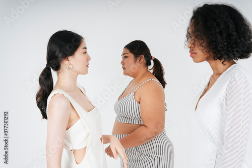 Obraz na plátně Diversity multi ethnicity of asian and african women over white background