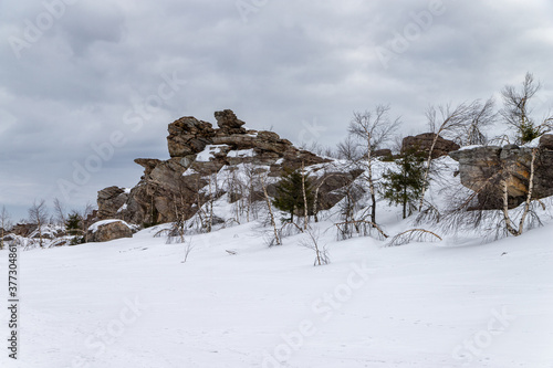 Rocks covered with snow. Rudyansky Spoy Ridge, Ural photo