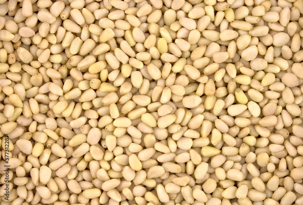 Background texture of shelled pine nuts. Background texture of shelled pine nuts.