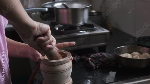 Grinding of Indian spices inside Indian kitchen by the hands of a lady. Indian kitchen and household