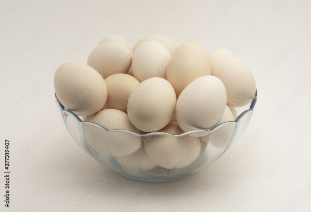 Chicken eggs in glass bowl Chicken eggs in glass bowl