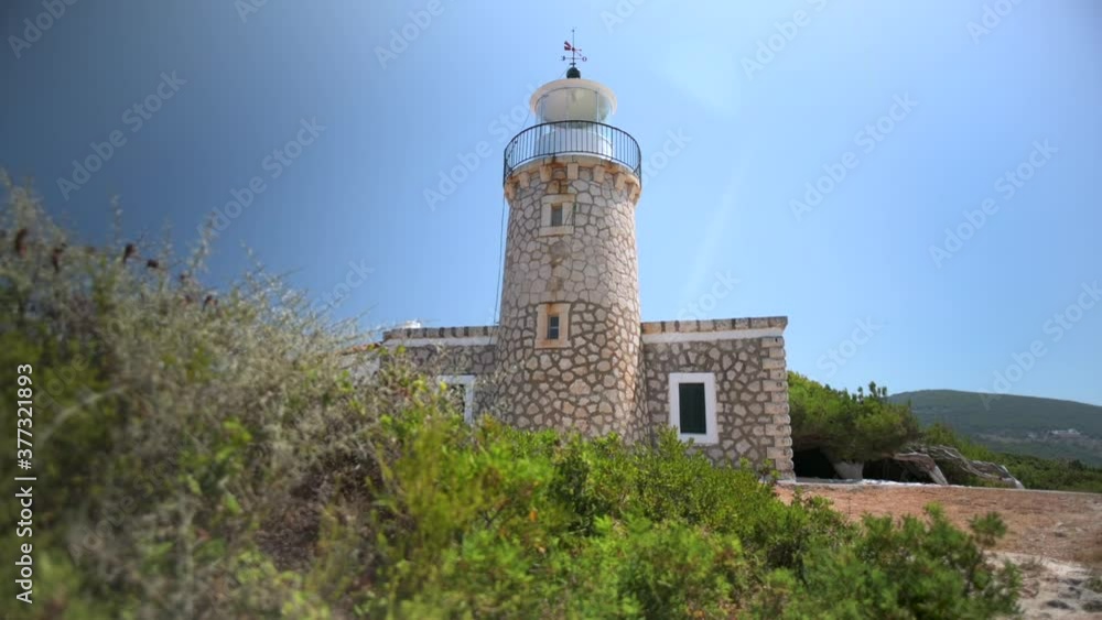 Beautiful stone lighthouse on the coast of Greece.