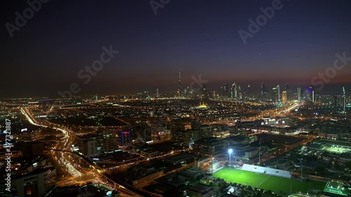 Wallpaper Mural An amazing aerial view extreme long shot  of downtown Dubai neighborhood at night with Burj Khalifa the world's tallest building, captivating street light Dubai UAE, Torontodigital.ca