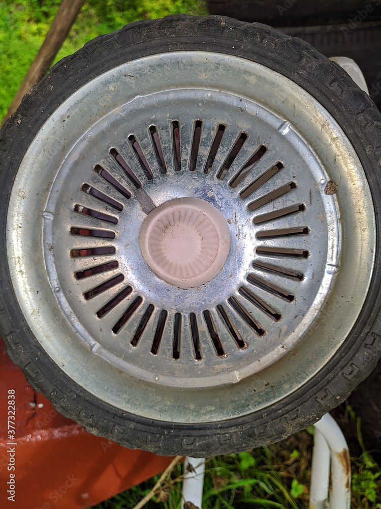 metal wheel from a small bike closeup photo
