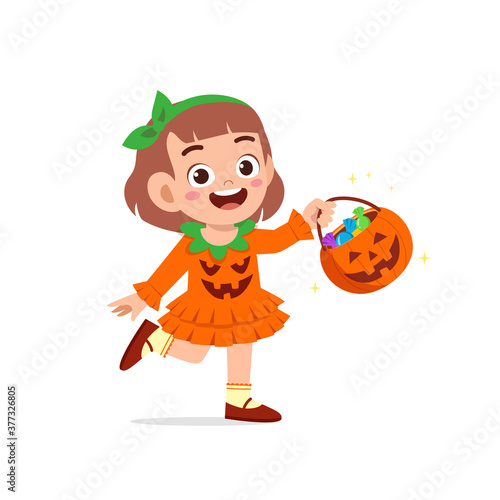 happy cute little kid boy and girl celebrate halloween wears pumpkin monster costume