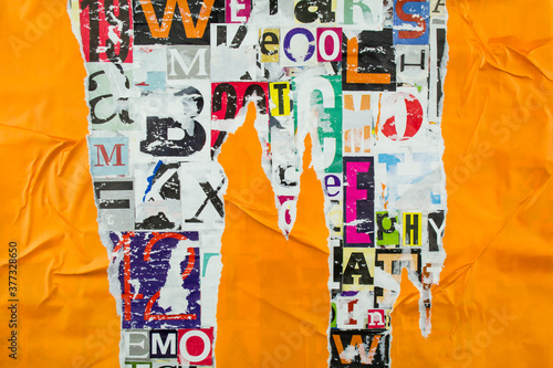 Torn and peeling orange paper on bright collage from clippings with letters and numbers texture background.