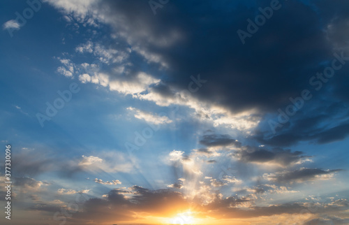 Beautiful bright sunset sky. Dramatic colorful clouds after sunset. Nature, sunset clouds backgrounds.