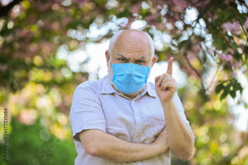Mask protecting from virus. Wear mask. Elderly and other risk groups. Pandemic concept. Limit risk infection spreading. Senior man wearing face mask. Older people at highest risk from covid-19