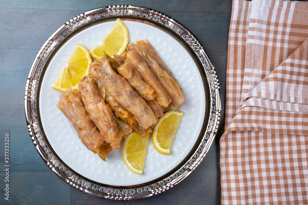 Lahana Sarma, Turkish traditional food,a boiled cabbage leaf that is formed into a roll with a stuffing of rice Lahana Sarma, Turkish traditional food,a boiled cabbage leaf that is formed into a roll with a stuffing of rice