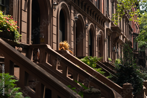 Row of Old Brownstone Homes in Lincoln Square of New York City with Staircases